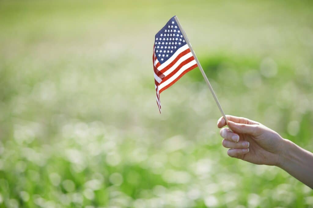 Woman holding US flag