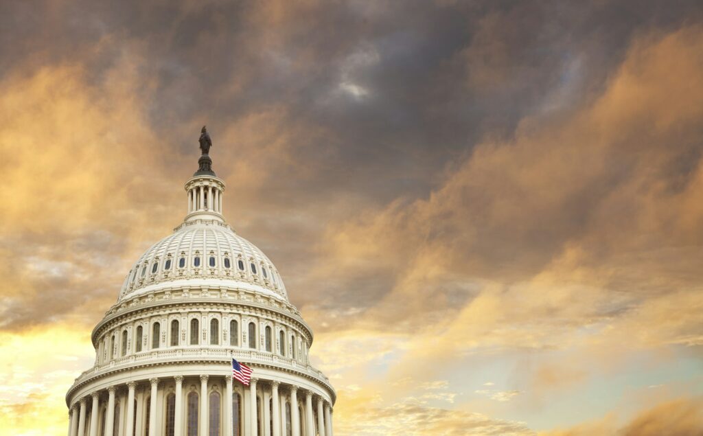 United States Capitol dome with dramatic clouds