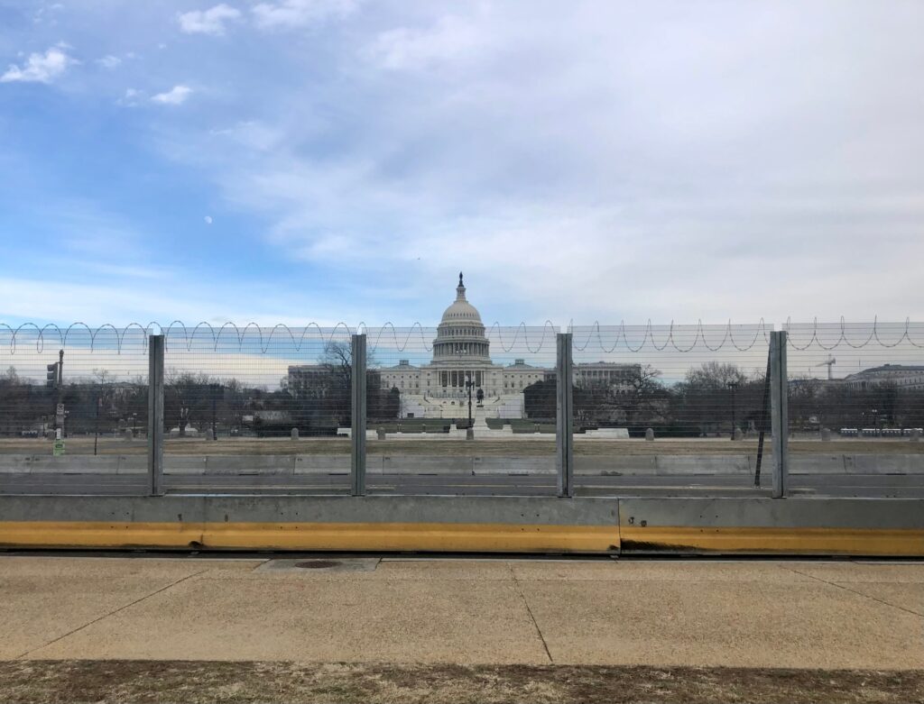 Razor wire security fence around US capitol building after insurrection from Trump supporters